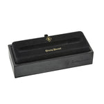Closed black Conway Stewart pen box with gold foil crest and ribbon pull tab